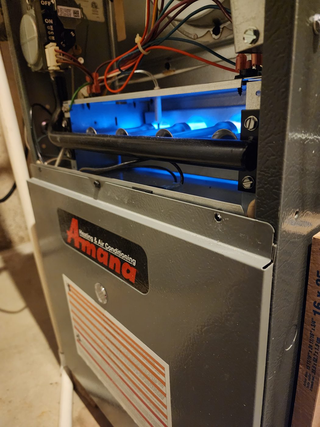 Open Amana furnace burners after V&L Heating and Cooling service