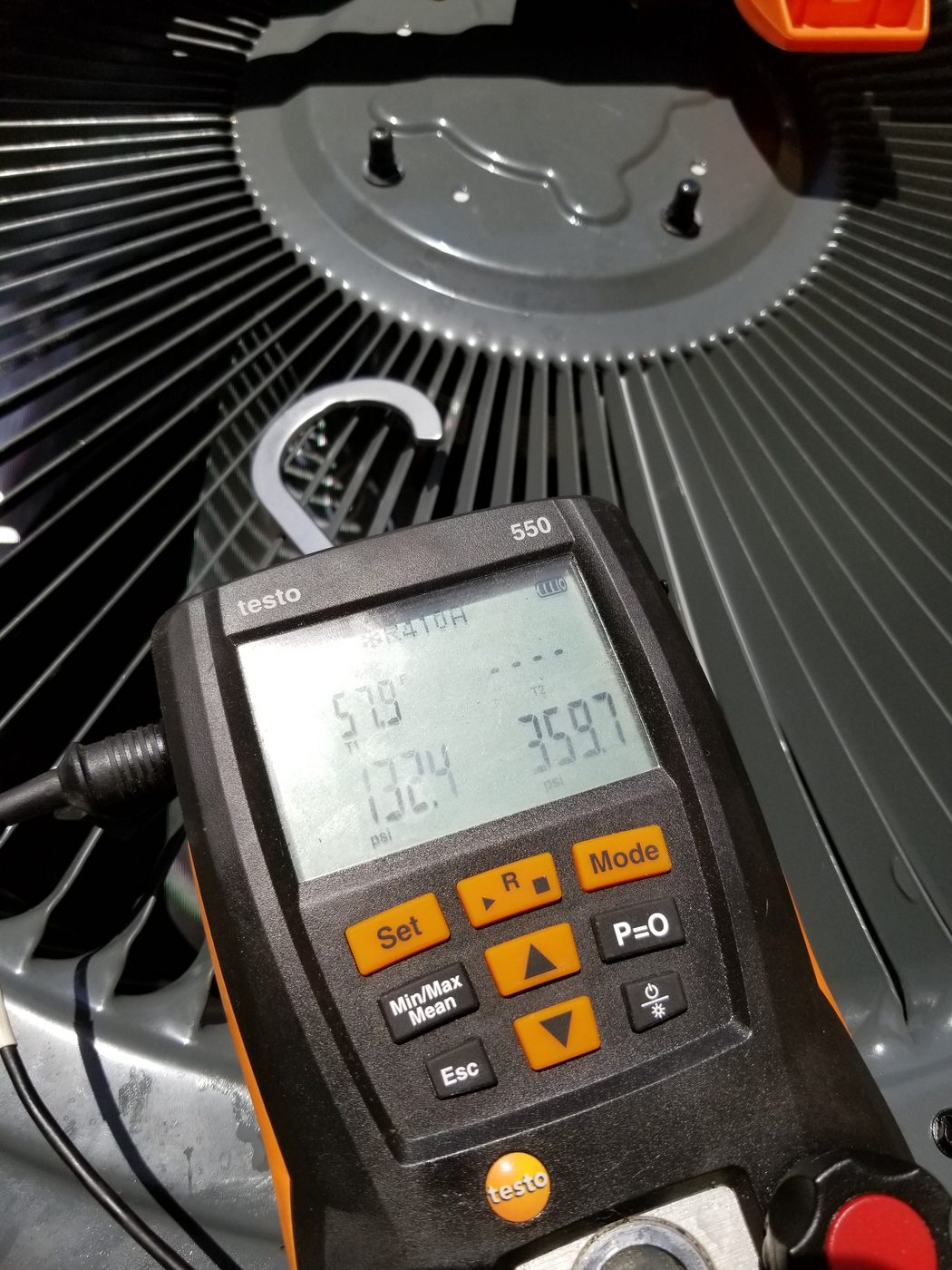 V&L technician gauges on a condenser in Manteno IL